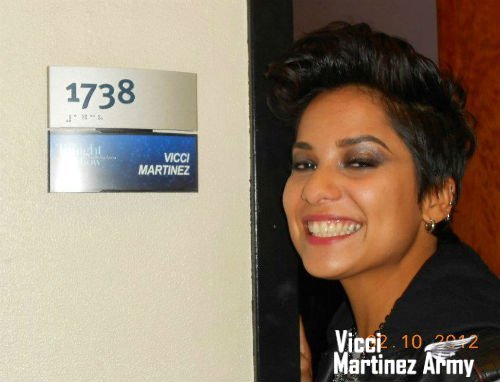 Vicci Martinez posing with her dressing room sign